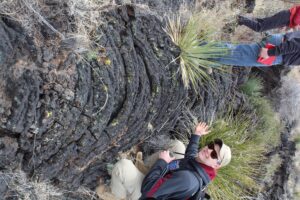 sideways image of a student next to basalt flow