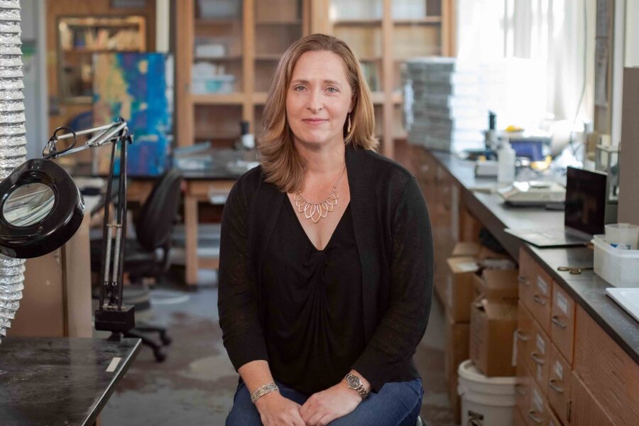 Andrea Dutton sitting in her lab.